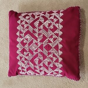 Maroon embroidered throw pillow